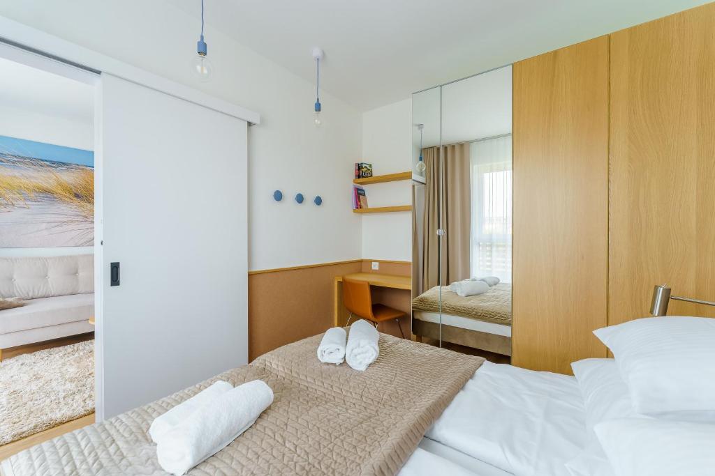 Posteľ alebo postele v izbe v ubytovaní Apartament DUNE SurfingBird Dźwirzyno