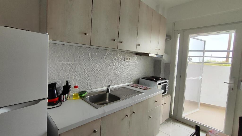 Kuchyň nebo kuchyňský kout v ubytování First line apartment