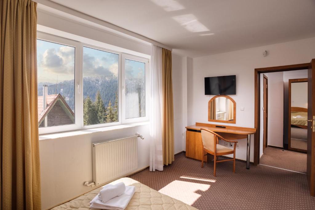 TV a/nebo společenská místnost v ubytování Hotel Bianca