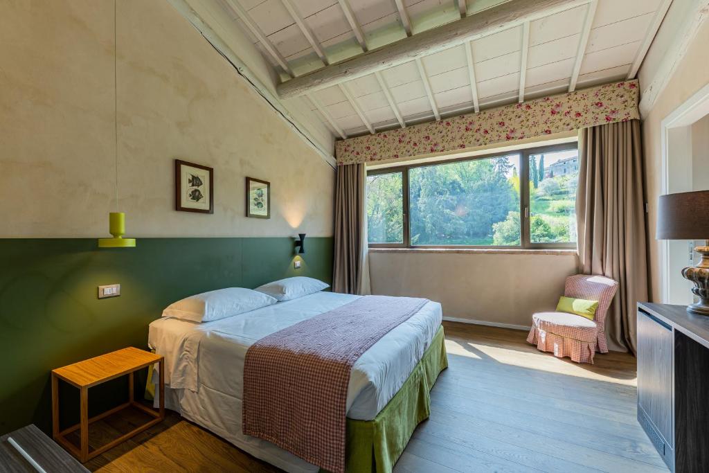 Postel nebo postele na pokoji v ubytování Relais Le Coste