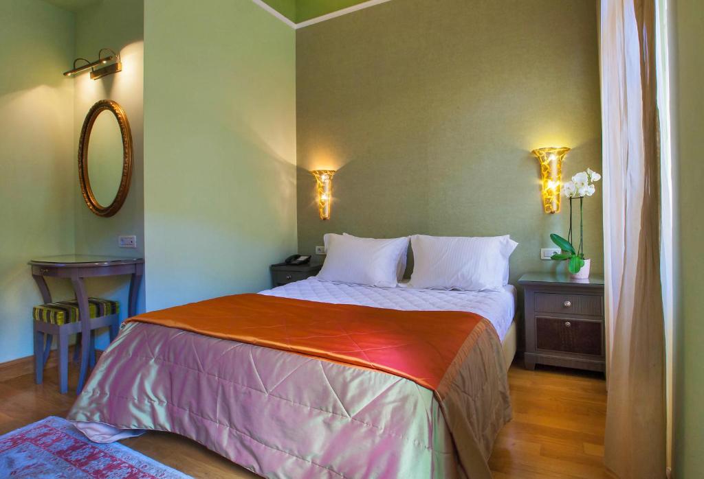 Posteľ alebo postele v izbe v ubytovaní Aetoma Hotel