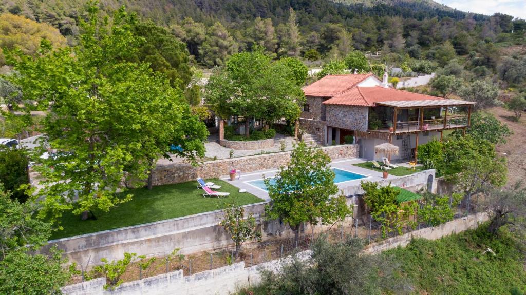 an aerial view of a house with a swimming pool at Calypso Villa with Jacuzzi Pool & Sea View in Nerotriviá