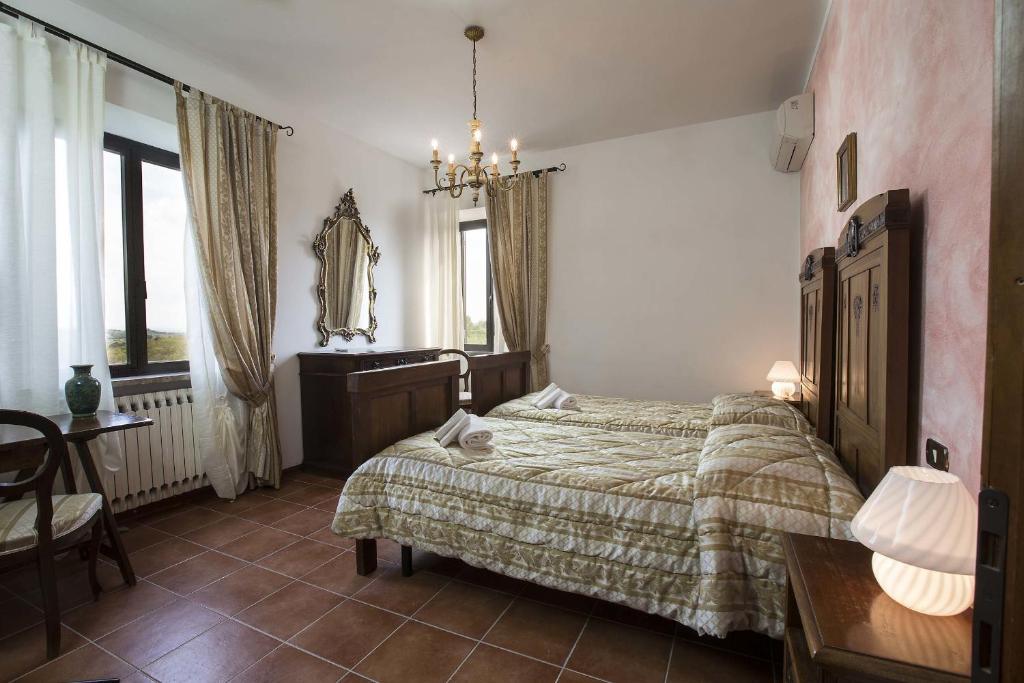 Postel nebo postele na pokoji v ubytování La Loggia - Villa Gloria -Adults Only