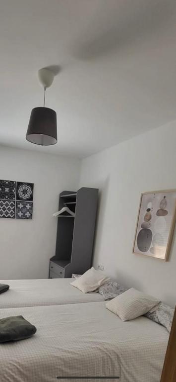 Postel nebo postele na pokoji v ubytování 3Centro Malaga especial grupos Parking gratis