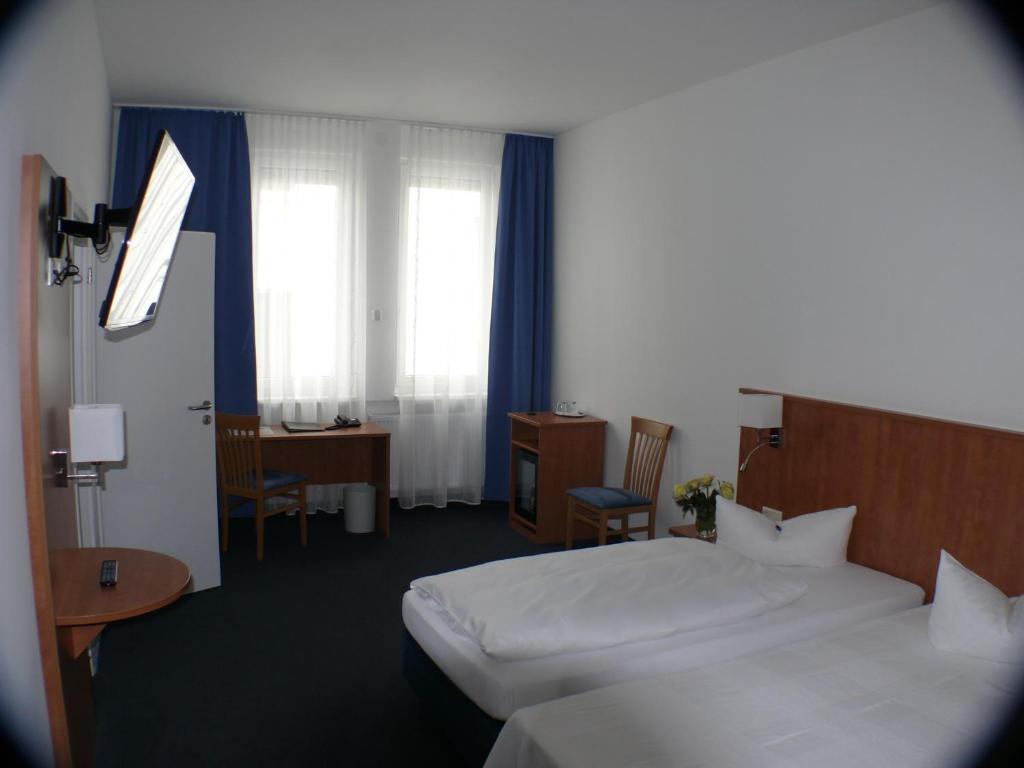 Postel nebo postele na pokoji v ubytování Hotel Garni - Haus Gemmer