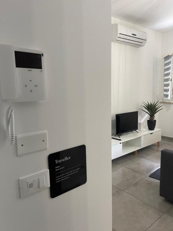 TV a/nebo společenská místnost v ubytování Cava Home - Castelli Apartments