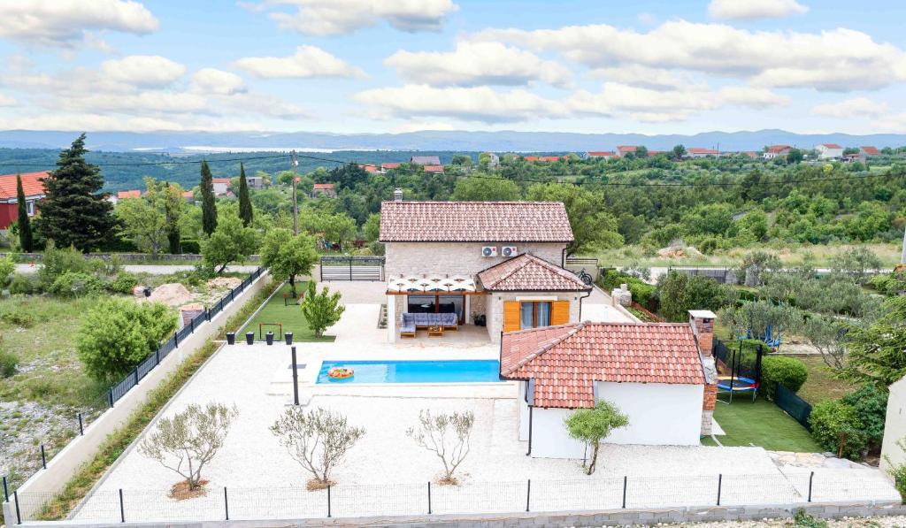 an aerial view of a house with a swimming pool at Villa Lucia in Skradin