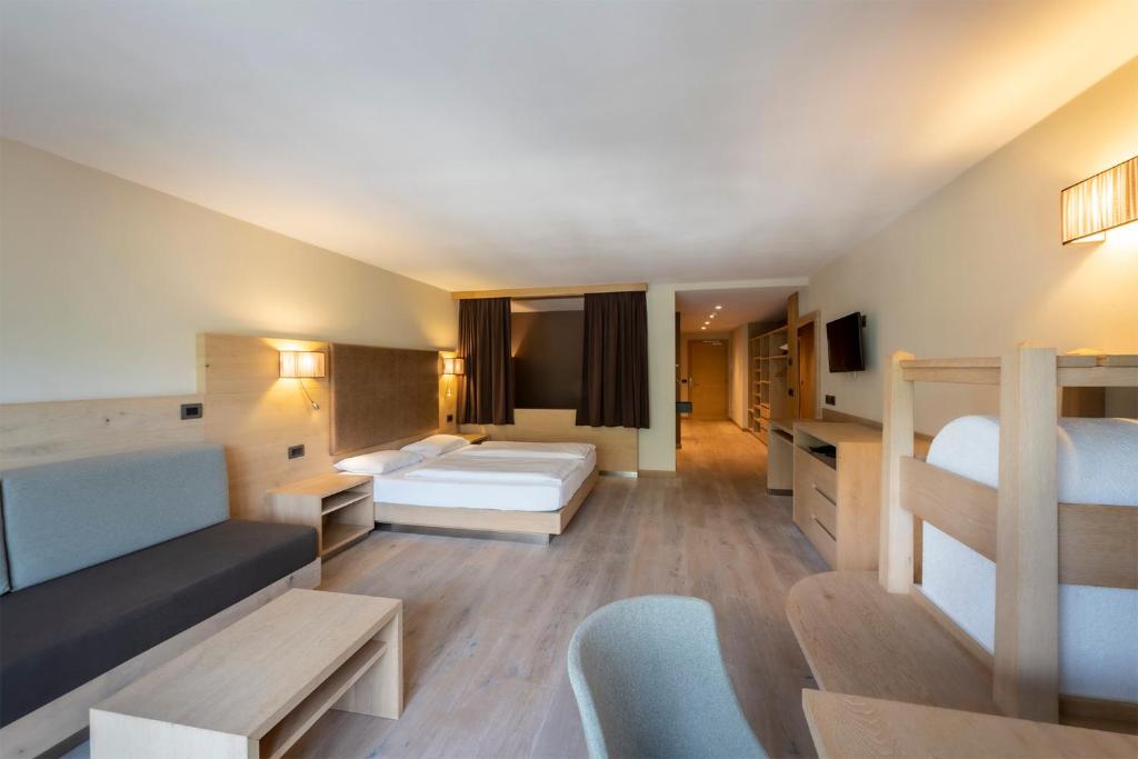 Postel nebo postele na pokoji v ubytování Design & Suite Hotel Ciarnadoi