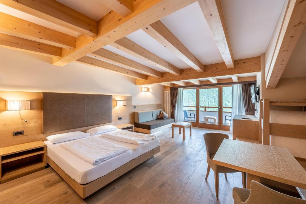 Postel nebo postele na pokoji v ubytování Design & Suite Hotel Ciarnadoi