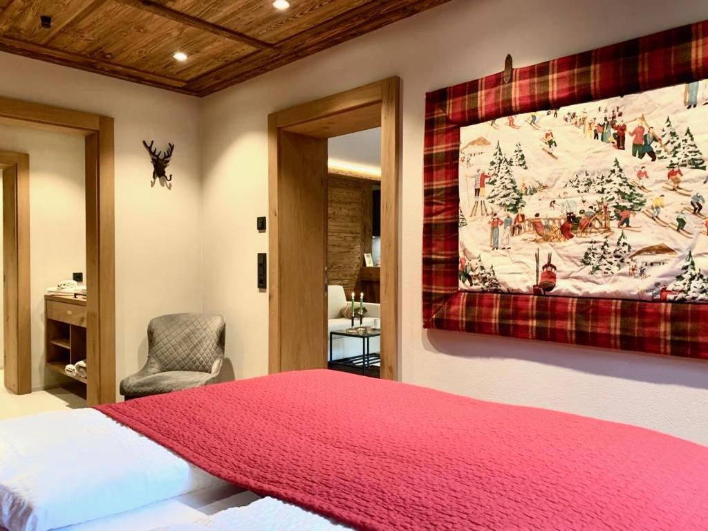 Postel nebo postele na pokoji v ubytování CHALET KITZBICHL by Alpin Charme Apartments