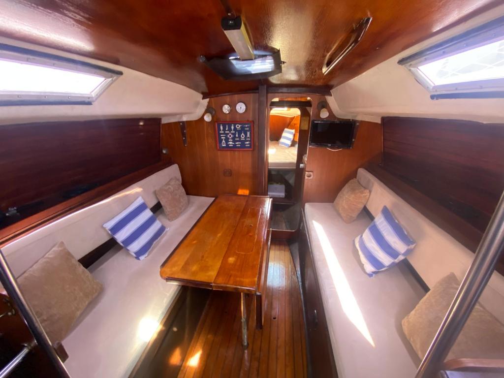 a view of the inside of a boat with a wooden table at Boat Barcelona Yacht in Barcelona