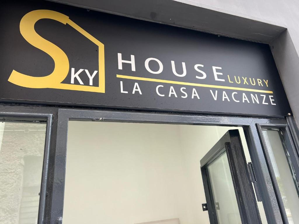 a sign for a house luxury la casa vazavas at SKY HOUSE LUXURY in Naples