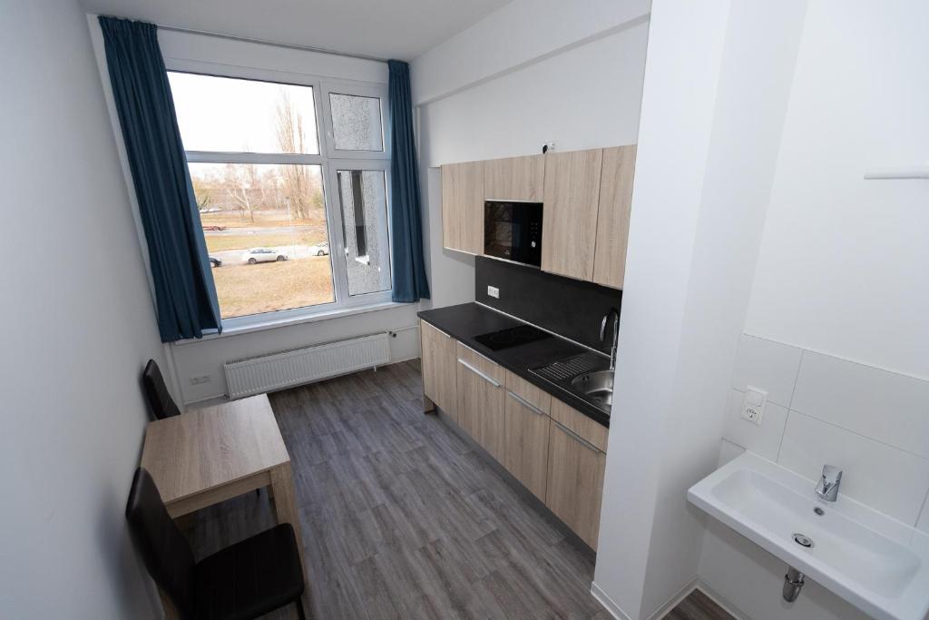 Kuchyň nebo kuchyňský kout v ubytování NeoHostel