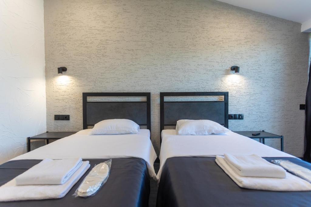Postel nebo postele na pokoji v ubytování Hotel West Way