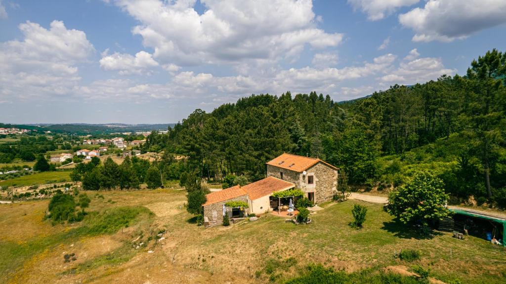 an aerial view of a house on a hill at Quinta da Cerdeira in Seia