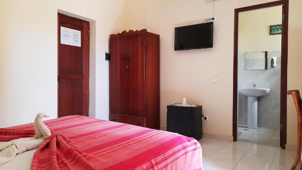 Postel nebo postele na pokoji v ubytování Residencial Rosa Criola