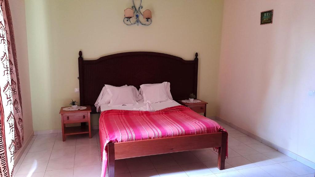 Postel nebo postele na pokoji v ubytování Residencial Rosa Criola