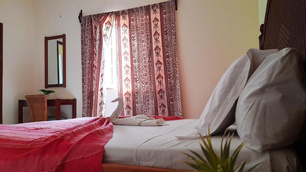 Postel nebo postele na pokoji v ubytování Residencial Rosa Criola