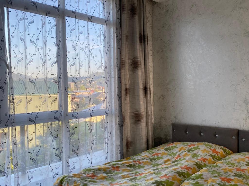 Postel nebo postele na pokoji v ubytování Merab House