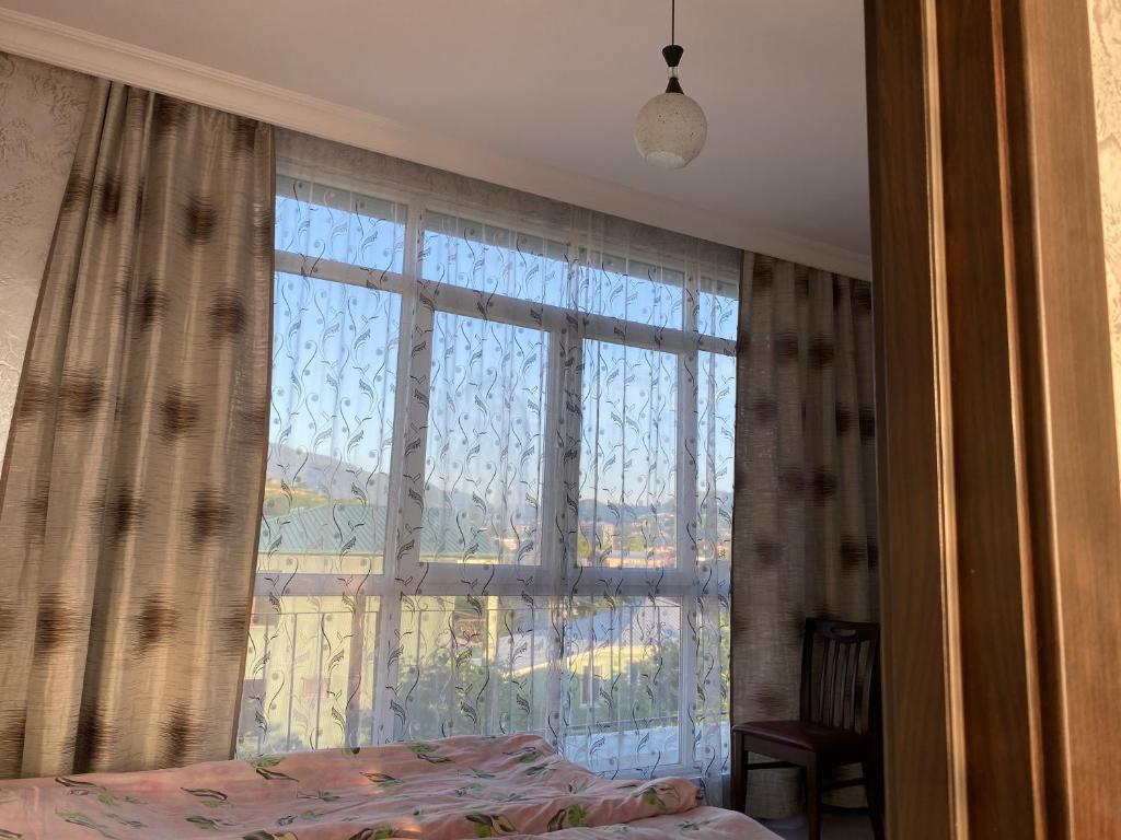 Postel nebo postele na pokoji v ubytování Merab House