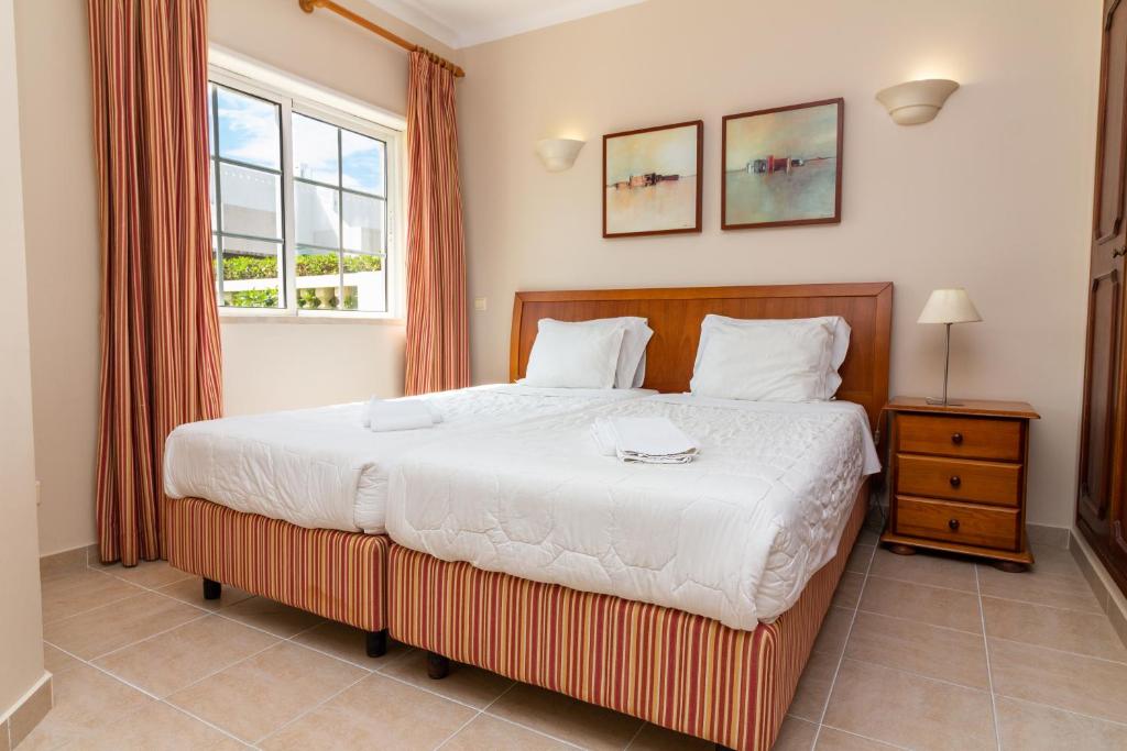 Postel nebo postele na pokoji v ubytování Vila do Castelo