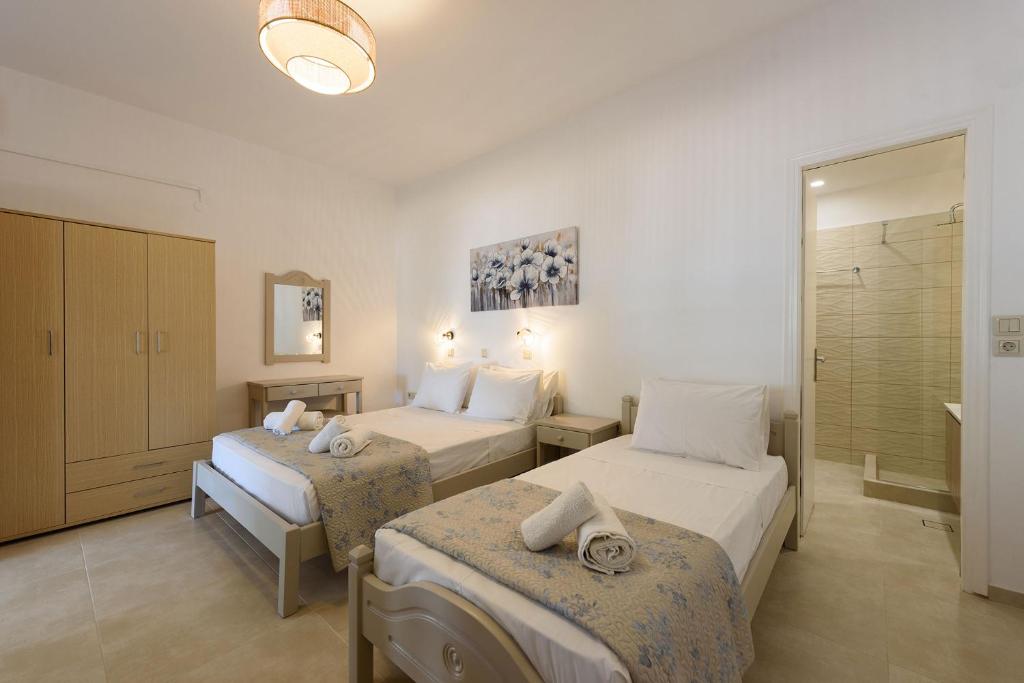 Postel nebo postele na pokoji v ubytování Sea Breeze Studios Paros