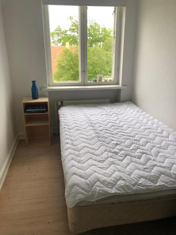 Postel nebo postele na pokoji v ubytování Sundkig fra 1. Sal