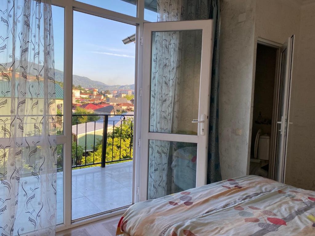 Postel nebo postele na pokoji v ubytování Merab House