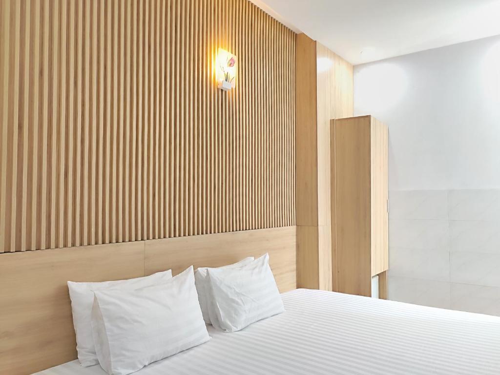 Postel nebo postele na pokoji v ubytování Thanh Hiền HB Hotel