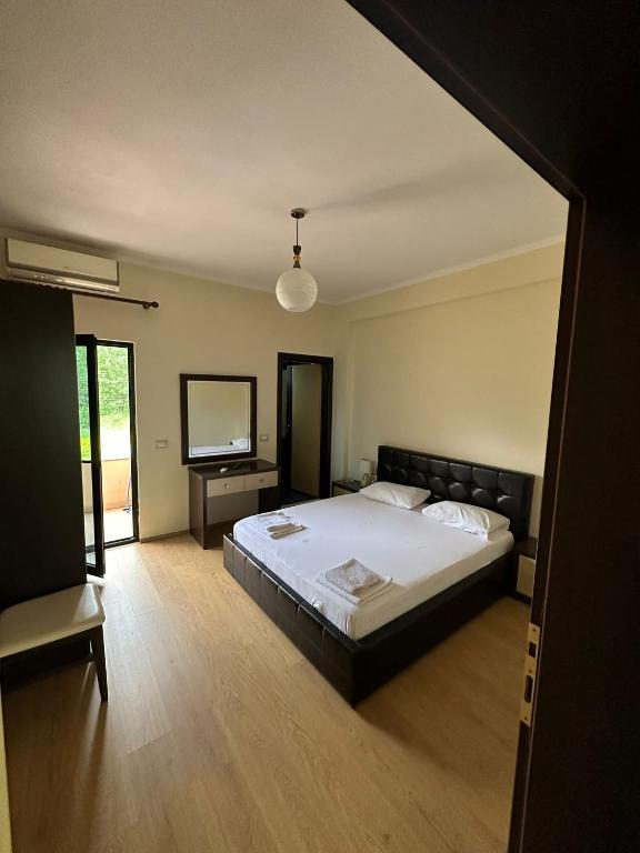 Postel nebo postele na pokoji v ubytování Grand Park Hotel