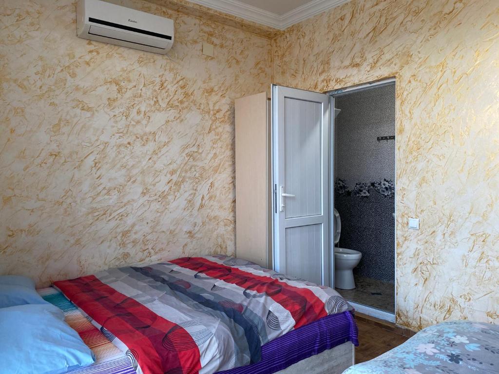 Postel nebo postele na pokoji v ubytování Merab House