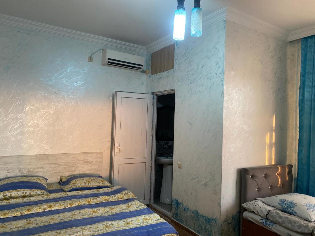Postel nebo postele na pokoji v ubytování Merab House