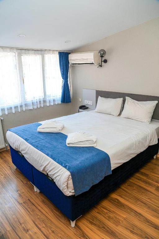 Postel nebo postele na pokoji v ubytování Asitane Life Hotel