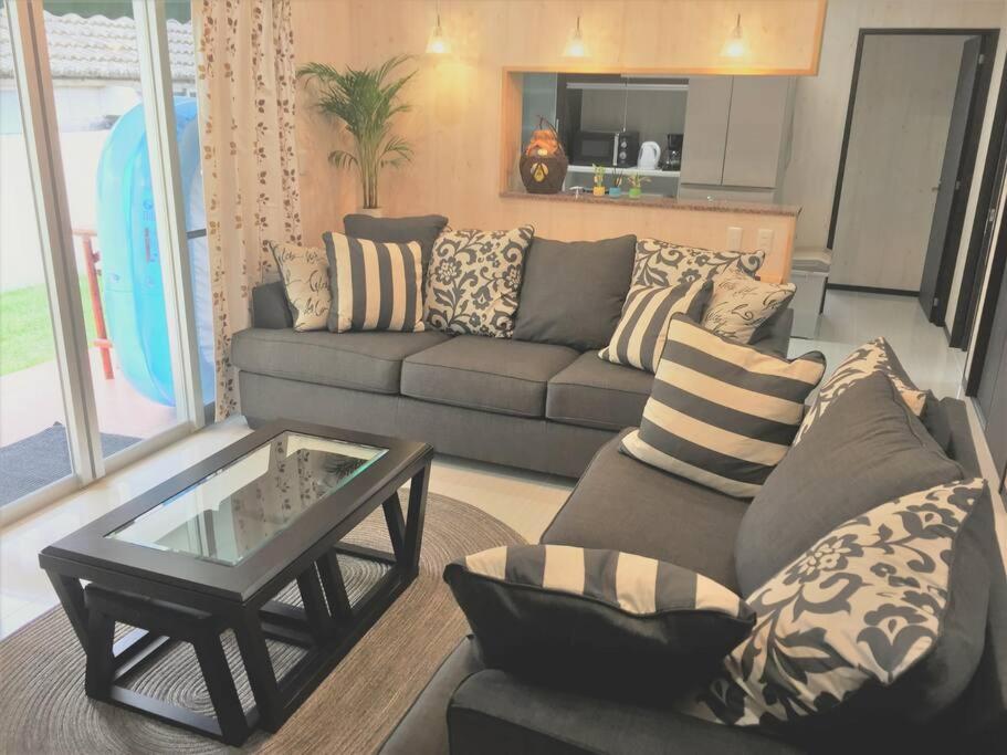 a living room with a couch and a coffee table at Vacation House Jo in Agarii