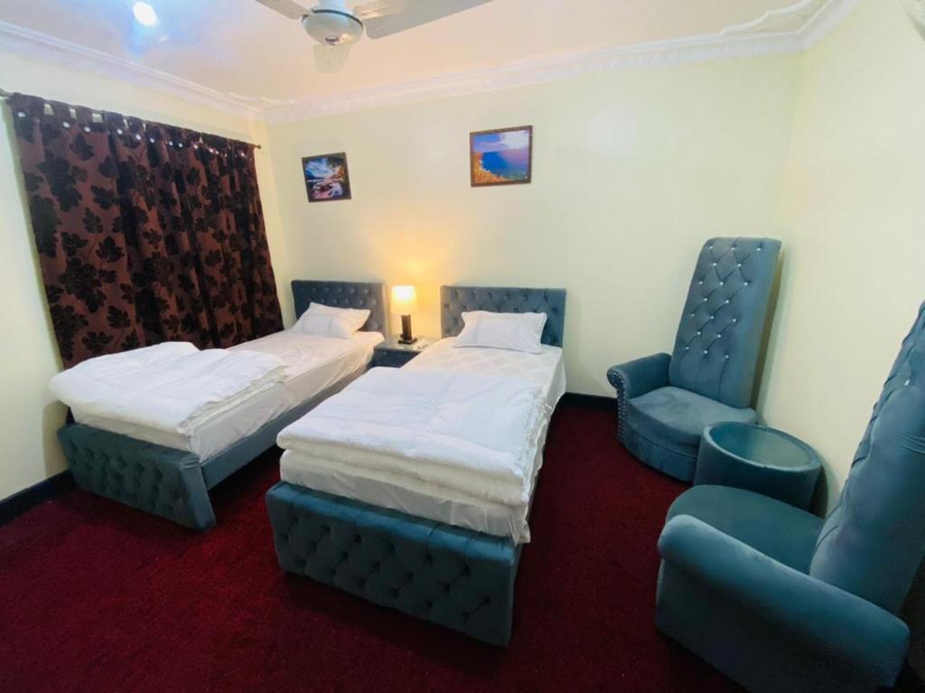 Postel nebo postele na pokoji v ubytování Ibex lodge Skardu