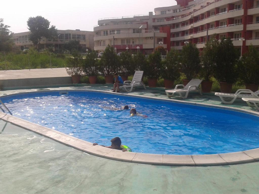 a group of people swimming in a swimming pool at Hotel Zora in Kranevo