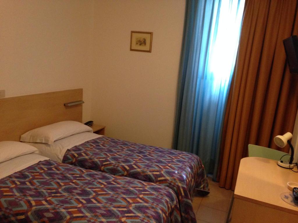 Postel nebo postele na pokoji v ubytování Hotel Johnson