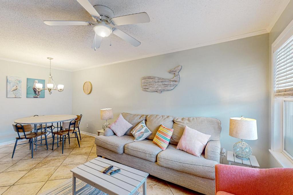 a living room with a couch and a table at Sunchase #208 in Gulf Shores
