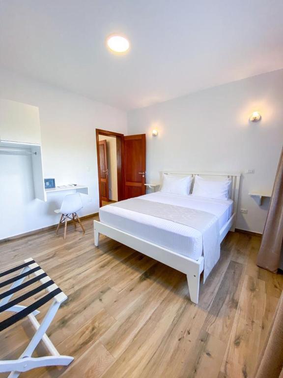 Postel nebo postele na pokoji v ubytování Aiolos Hotel & Discoveries