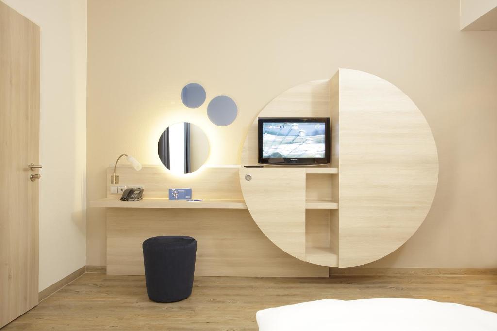 TV a/nebo společenská místnost v ubytování H2 Hotel Berlin-Alexanderplatz