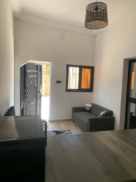 a living room with a couch and a table at residence hadja Mamelles in Dakar