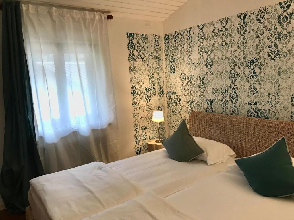 Postel nebo postele na pokoji v ubytování Sleep In Venzone Depandance