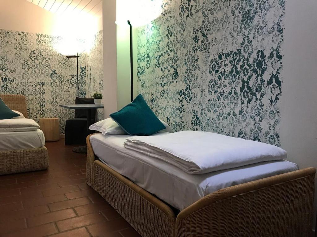 Postel nebo postele na pokoji v ubytování Sleep In Venzone Depandance