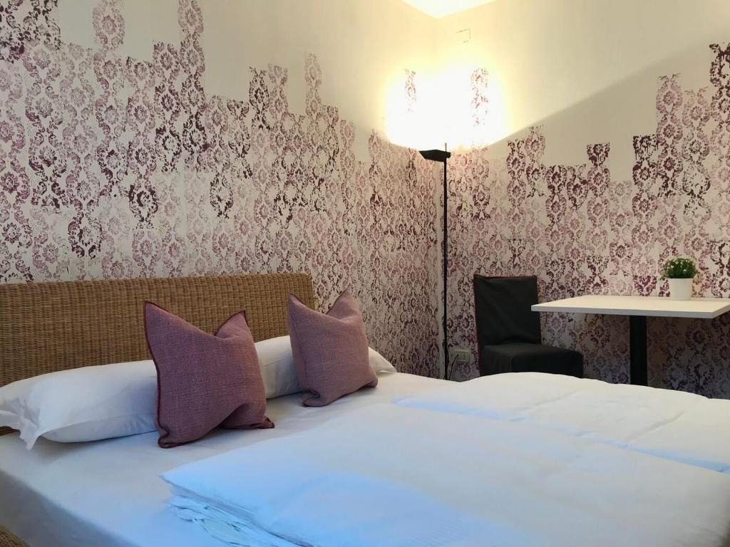 Postel nebo postele na pokoji v ubytování Sleep In Venzone Depandance