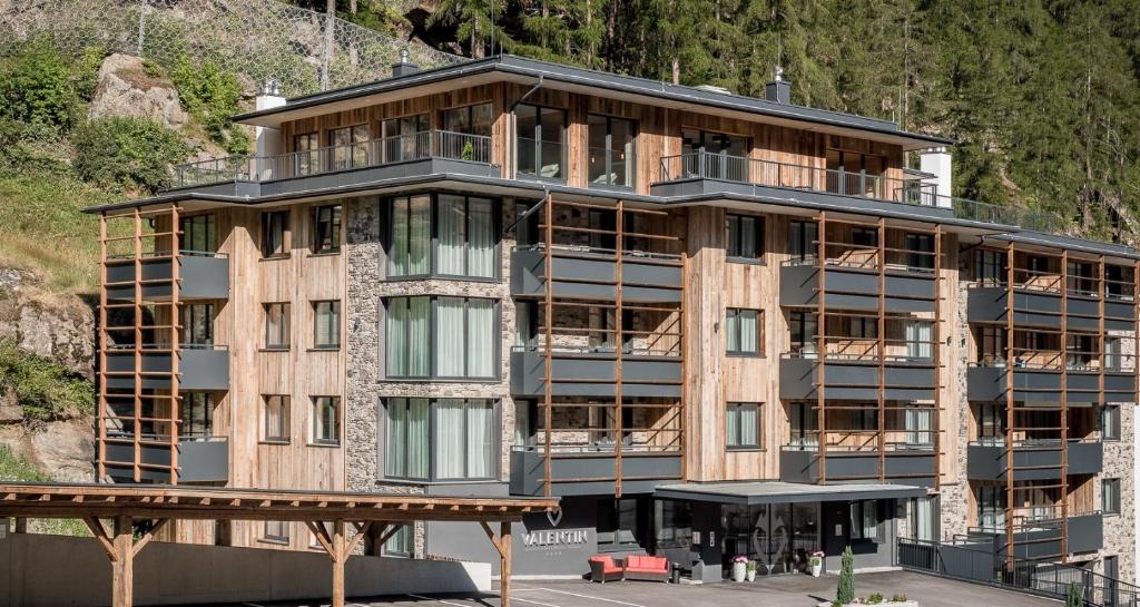 a building on the side of a mountain at Valentin Design Apartments in Sölden