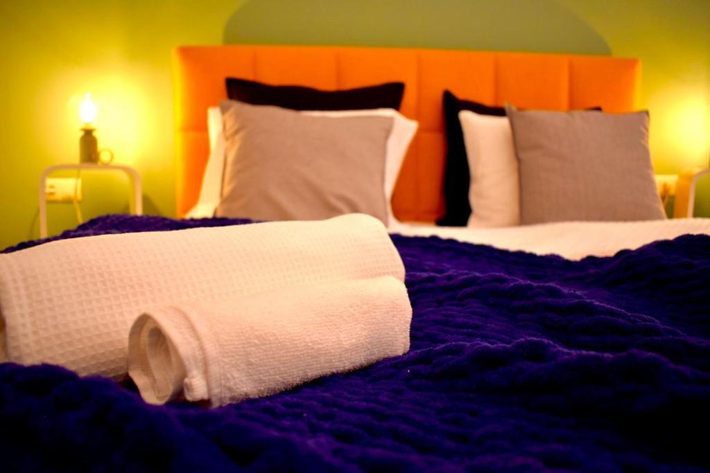 Postel nebo postele na pokoji v ubytování Carmen Art Hotel