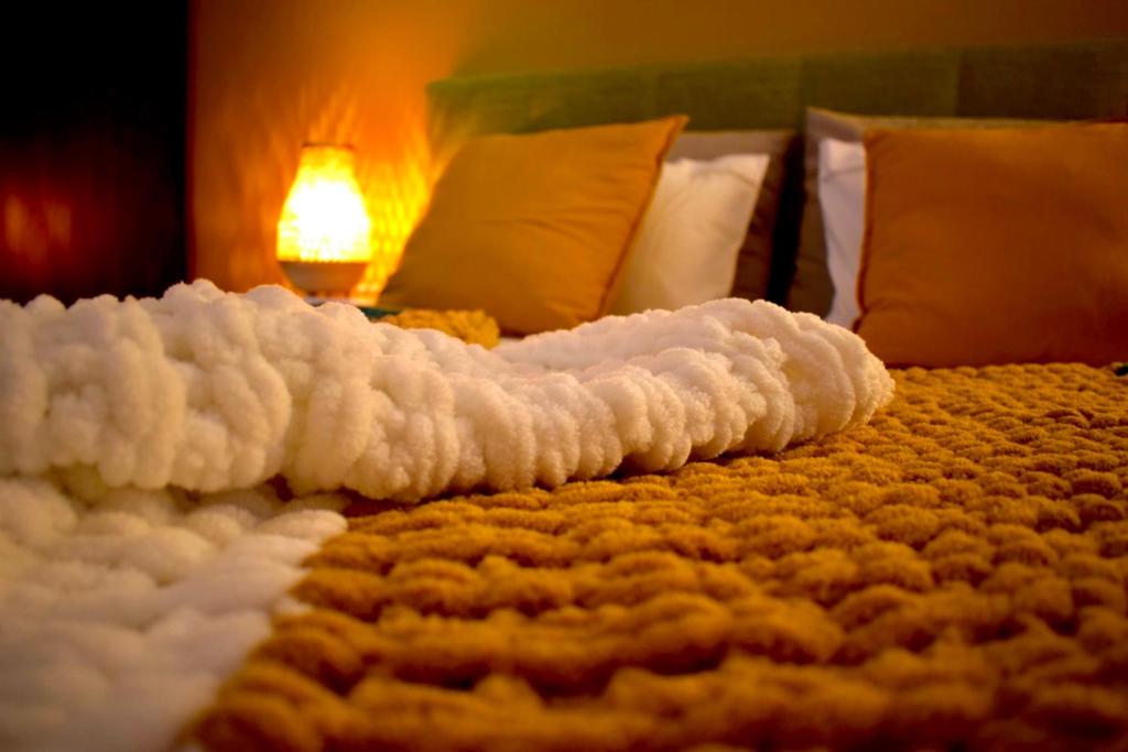 Postel nebo postele na pokoji v ubytování Carmen Art Hotel