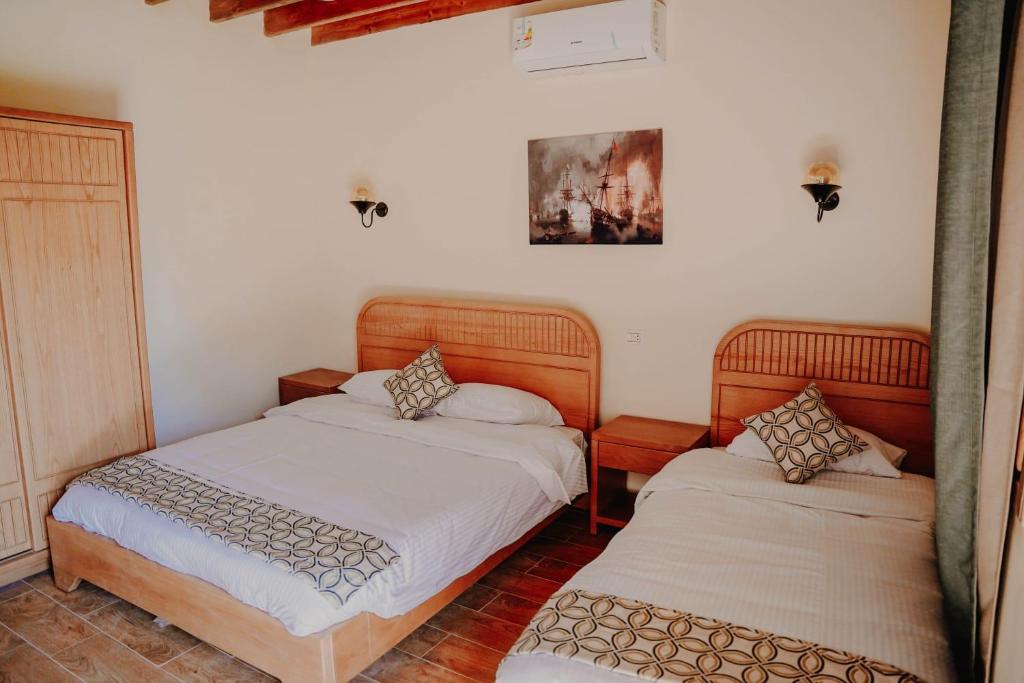 Postel nebo postele na pokoji v ubytování Tunis Pyramids Hotel - فندق اهرامات تونس