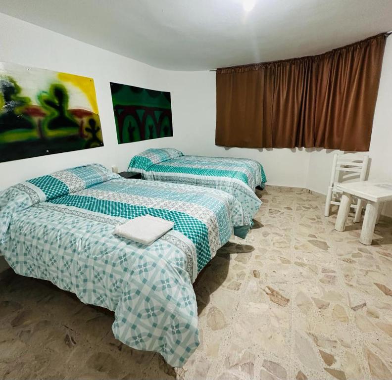 Postel nebo postele na pokoji v ubytování Hotel Villa 12 Orquídeas