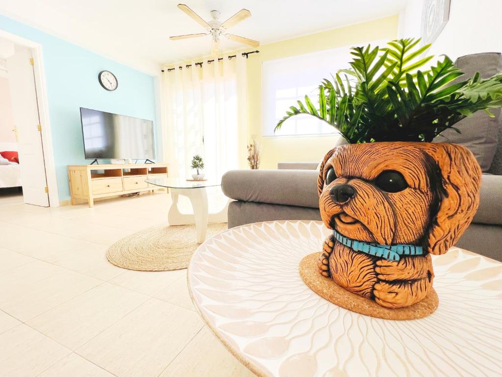 a statue of a dog sitting on a table in a living room at !!! Relaxing View, The Heights Apartment With Terrace and Heated Pools, Los Cristianos in Los Cristianos